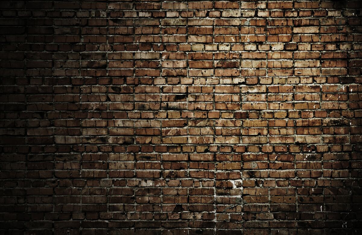 Фотошпалери темна цегляна стіна