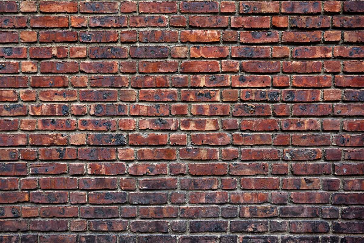 Фотошпалери темна цегляна стіна
