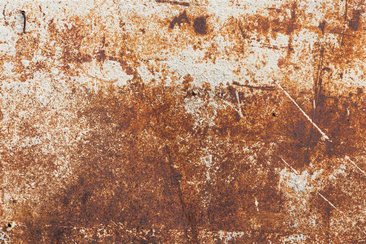 Фотошпалери подряпана стіна, пофарбована в темні тони іржі
