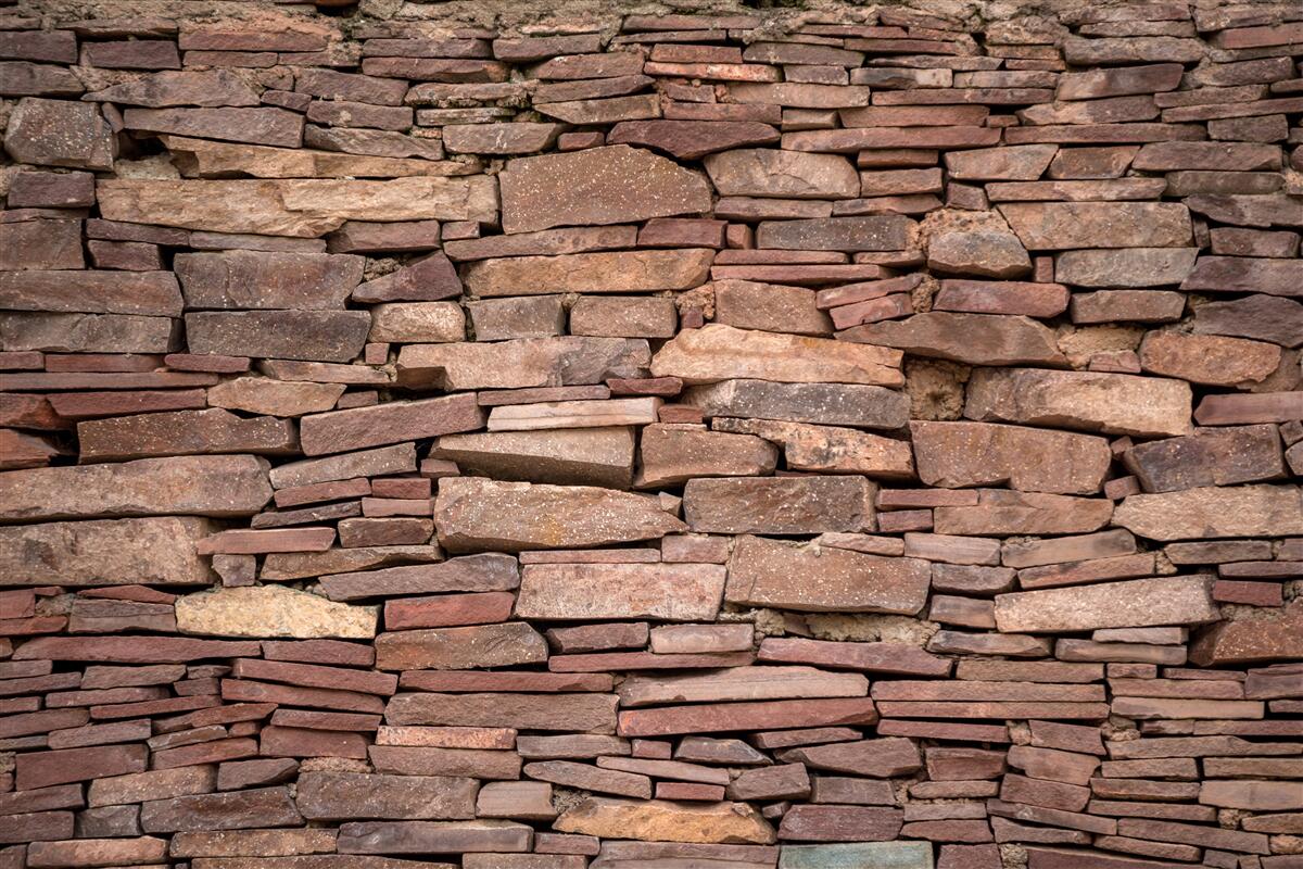 Фотошпалери бар'єр з коричневого каменю з нерівномірною текстурою