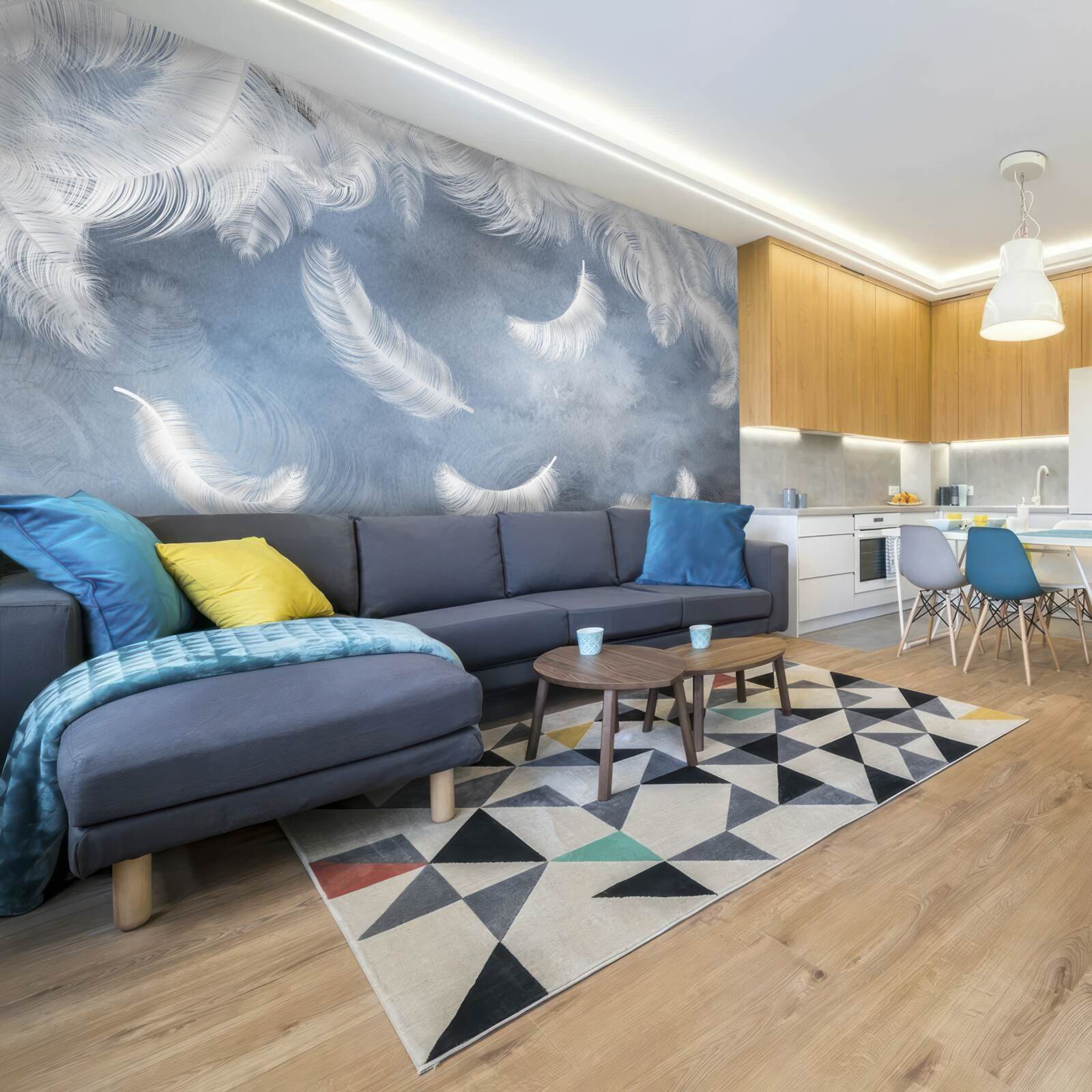 Фотошпалери пір'я летить сніжно-біле на тлі блакитного неба