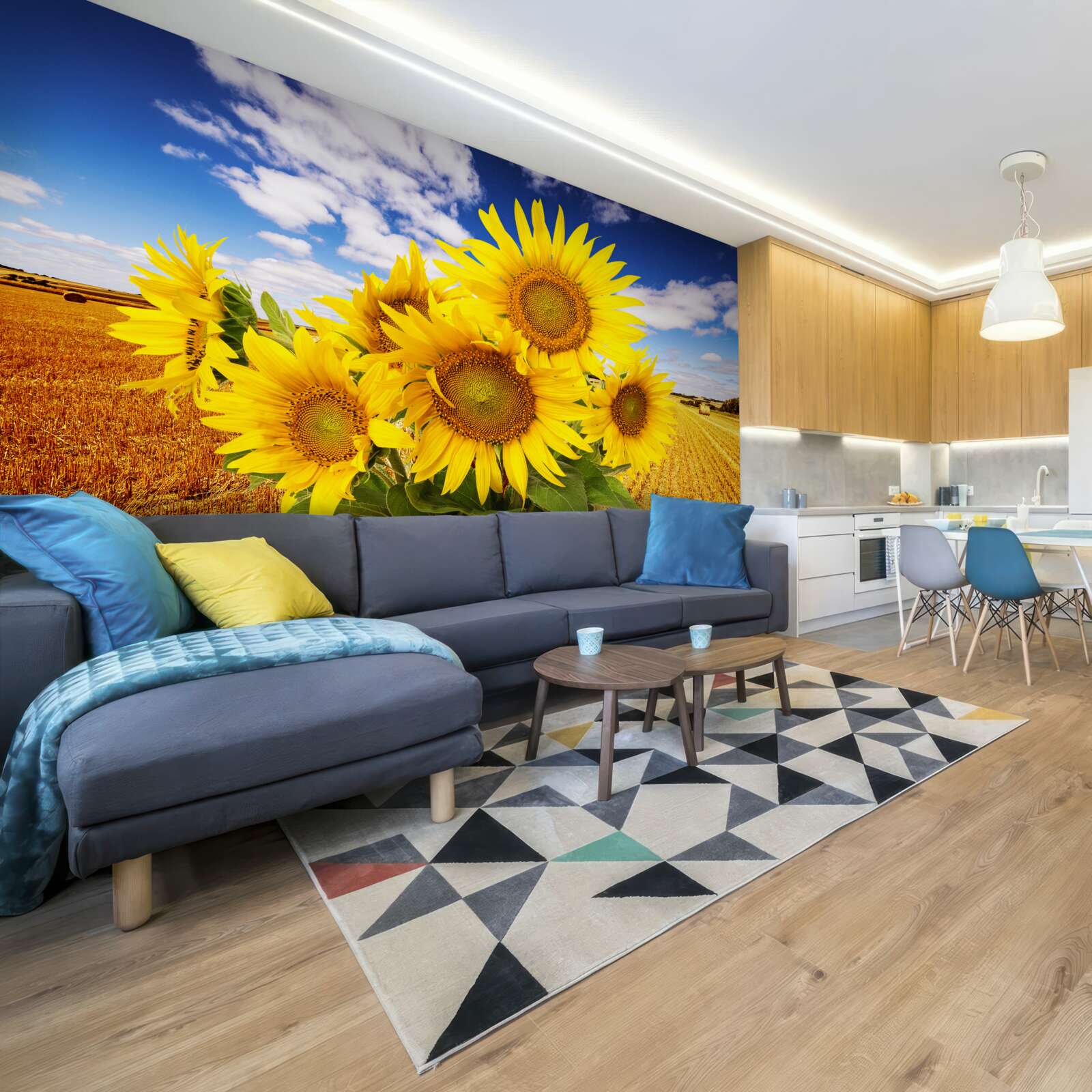 Фотошпалери на тлі неба і поля пшениці видніється букет соняшників