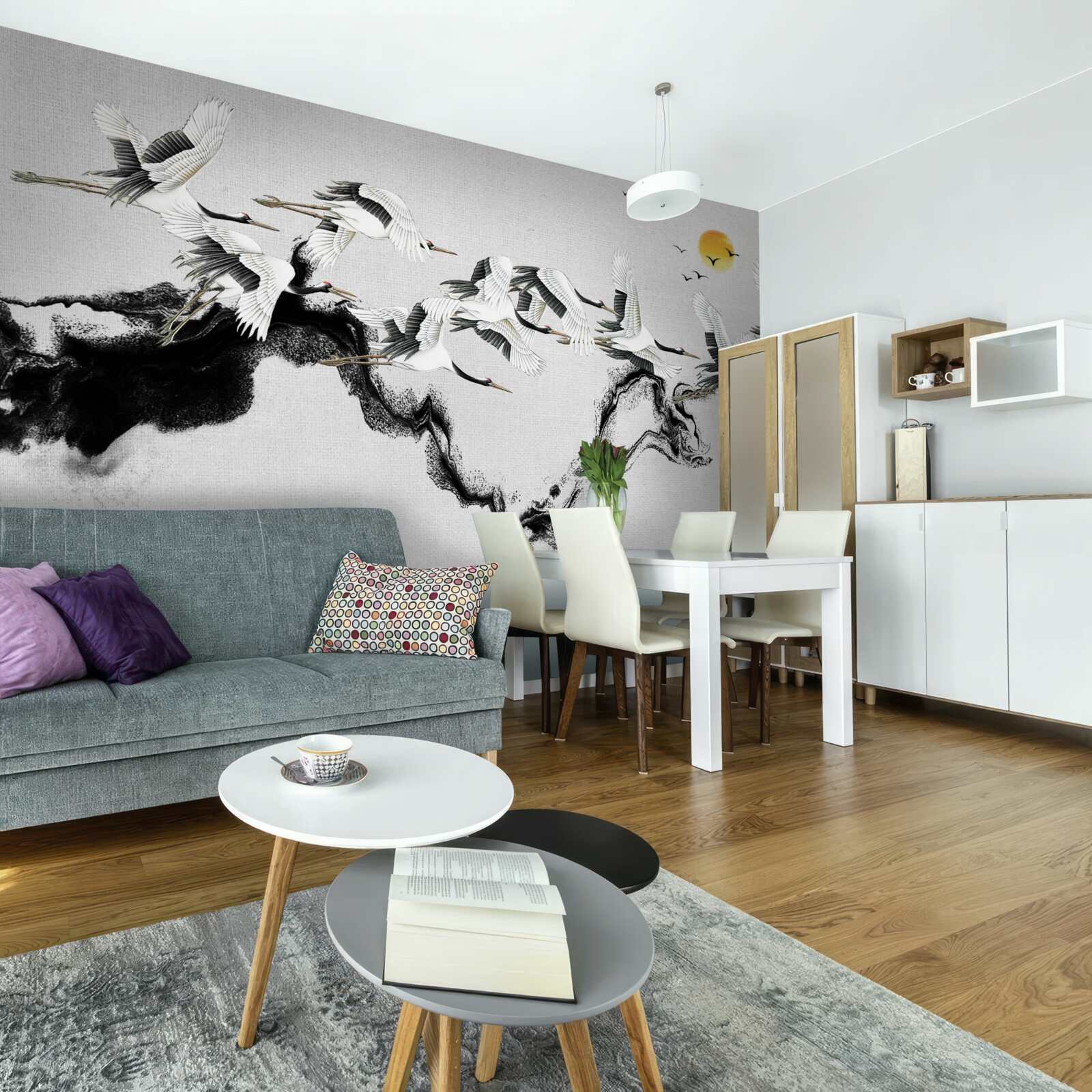 Фотошпалери група японських журавлів, що летять на захід сонця