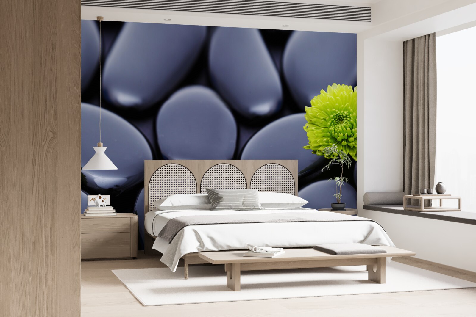 Фотошпалери зелена квітка росте над кам'янистим бар'єром