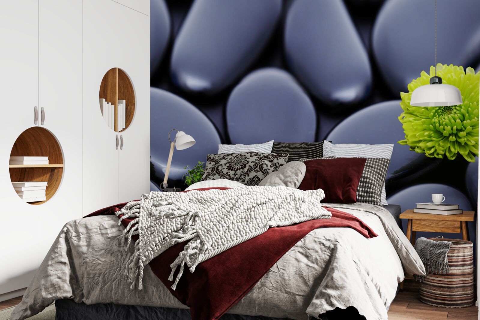 Фотошпалери зелена квітка росте над кам'янистим бар'єром