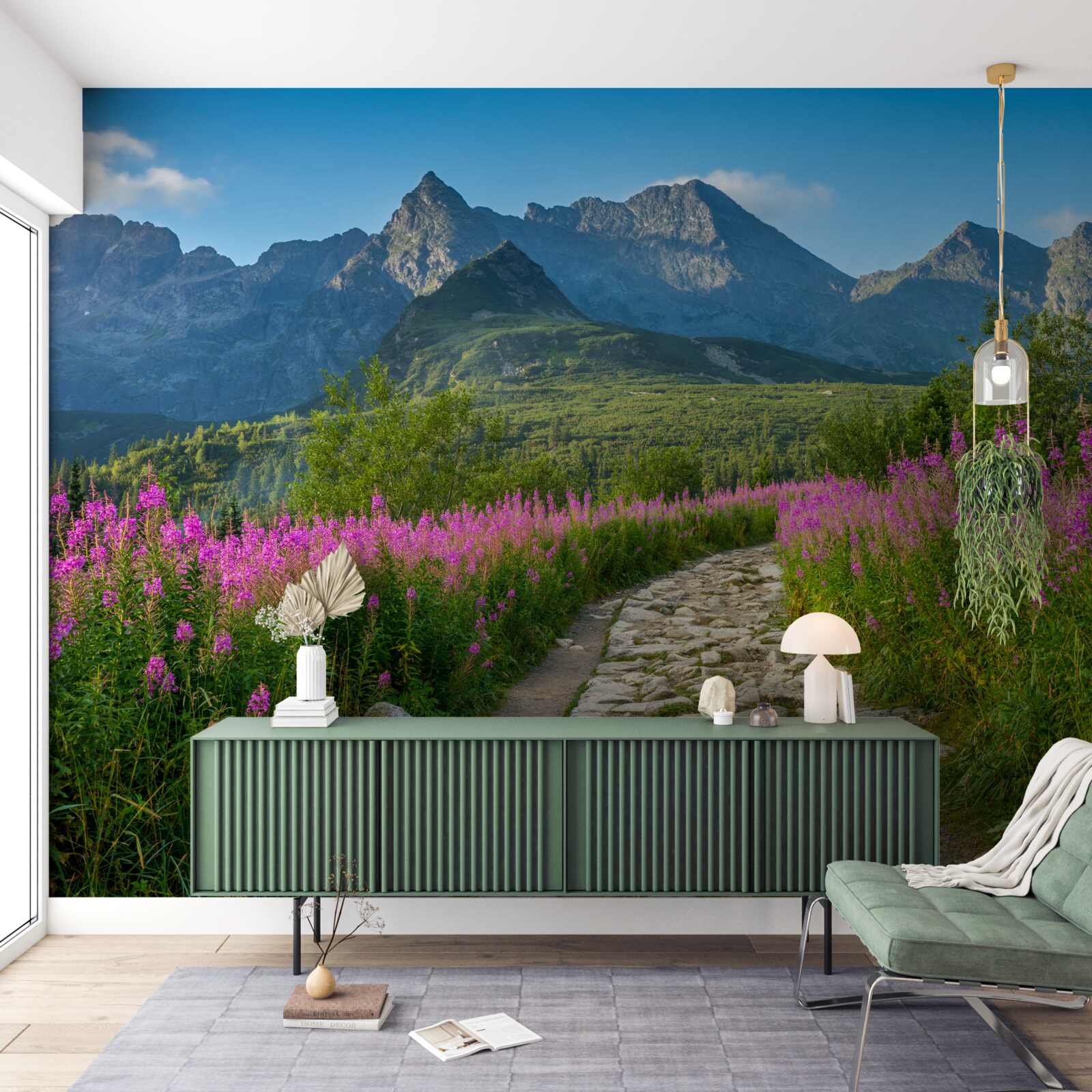 Фотошпалери Стежка посеред квітучого поля в гірській місцевості