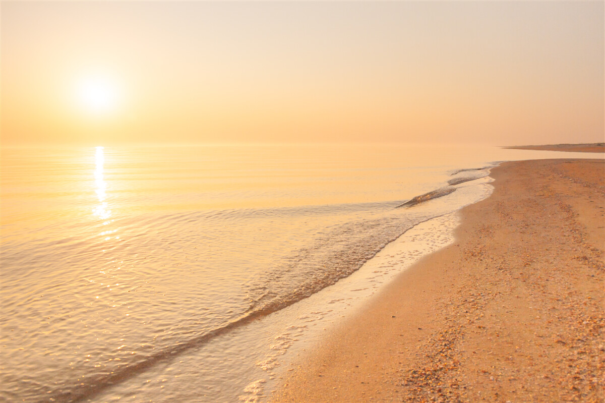 Фотошпалери захід сонця над морем влітку