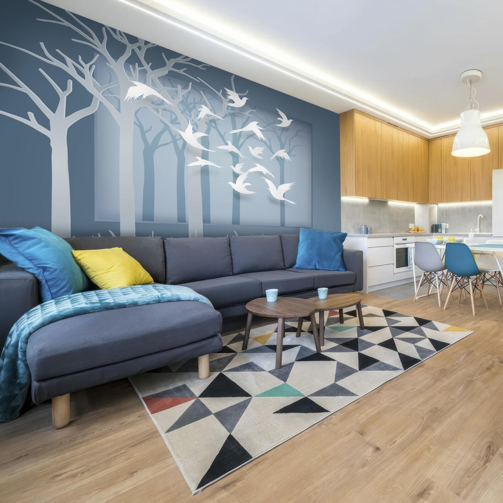 Фотошпалери група легких птахів перетинає небо над нічним чагарником