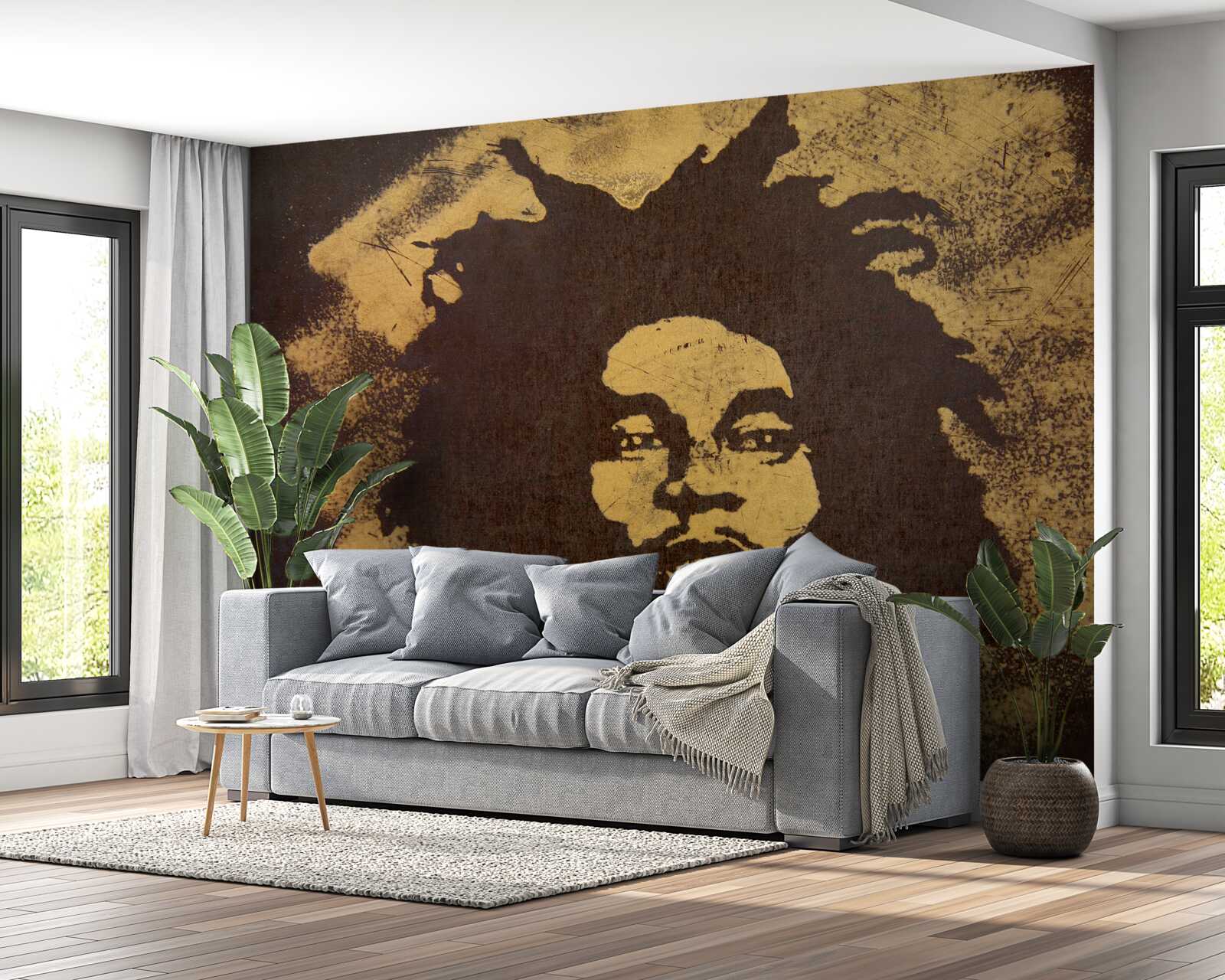 Фотошпалери чоловік з африканською зачіскою сидить на піску