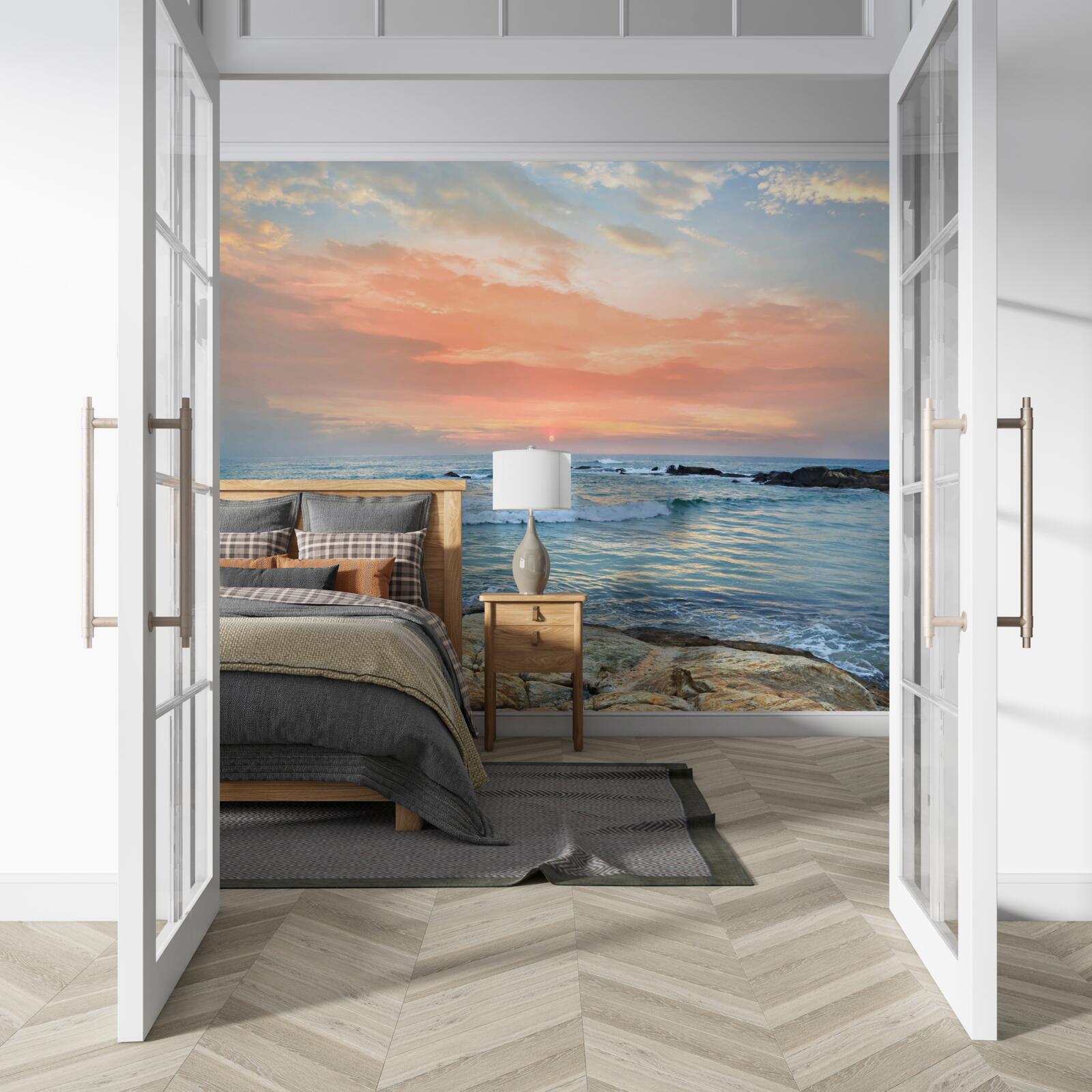 Фотошпалери океан, що тягнеться до горизонту, і рожевий захід сонця